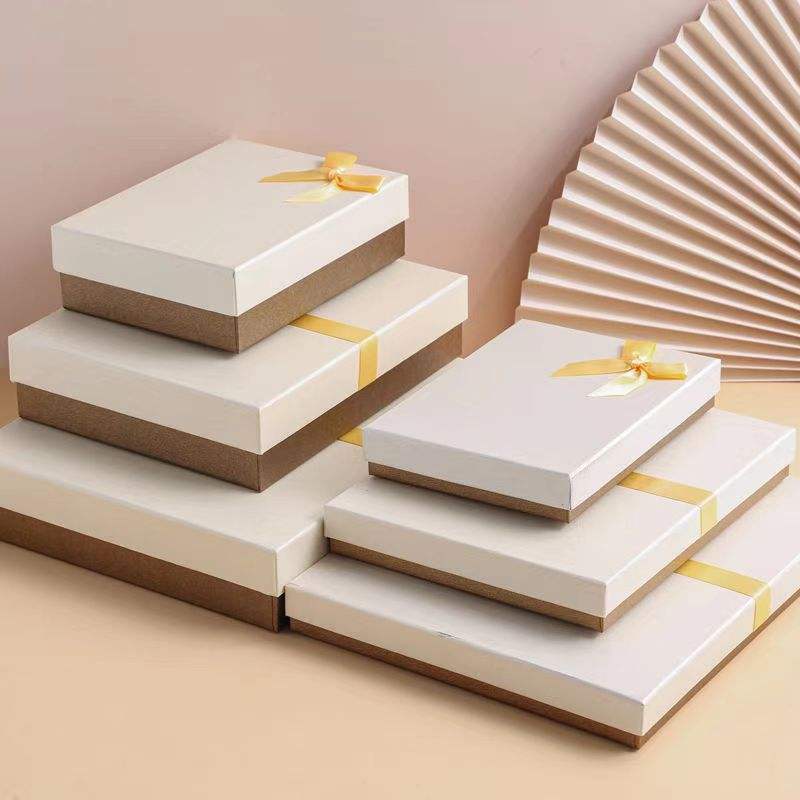 Elegant beige scarf skincare gift box with ribbon design